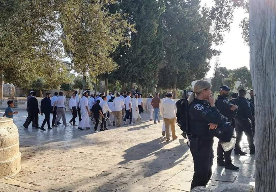 Colonial Israeli settlers guarded by well-armed Israeli forces break into Jerusalem’s Al-Aqsa Mosque on June 5, 2022.