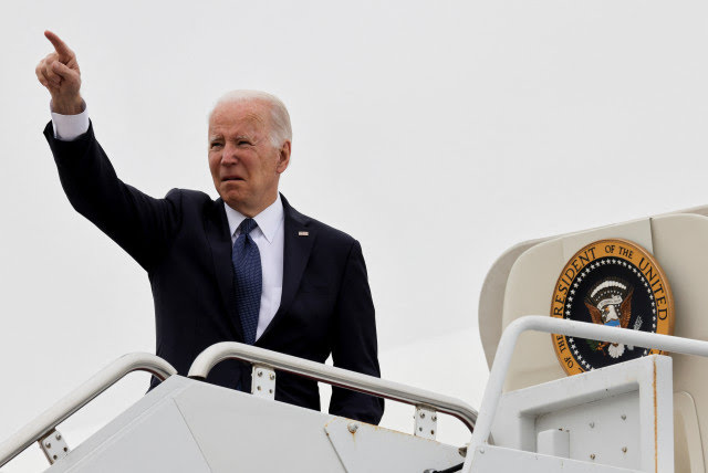 US President Joe Biden gestures as he boards Air Force One at Delaware Air National Guard Base, in New Castle, Delaware, US, April 25, 2022. (photo credit: TASOS KATOPODIS/ REUTERS)