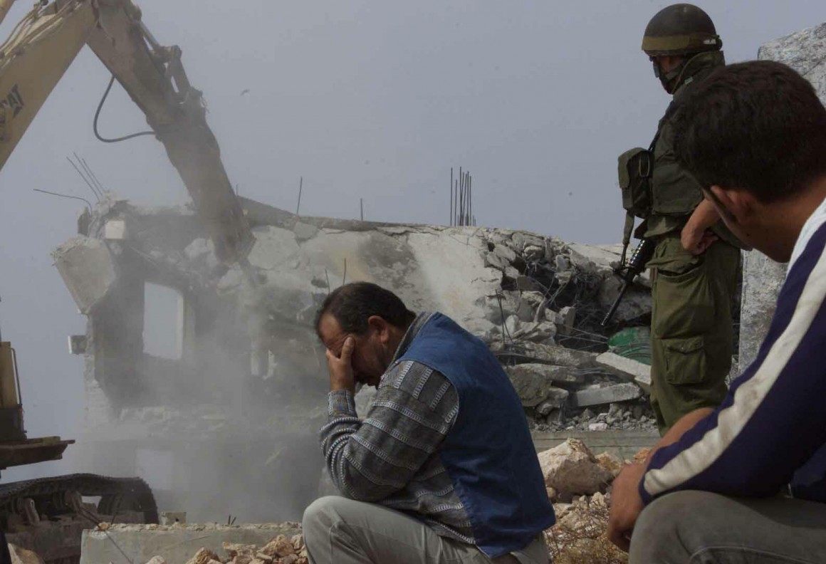 Israeli bulldozers demolish a home in Hebron