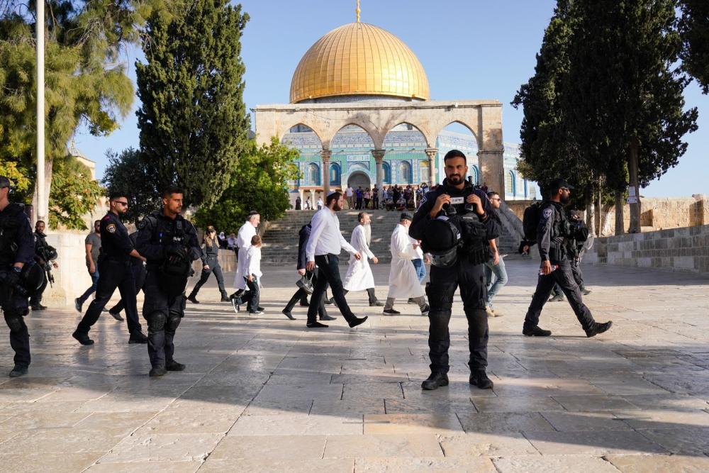 Dozens of Israeli settlers, guarded by Israeli occupation forces IOF, broke into the courtyards of Al-Aqsa Mosque and performed provocative rituals on Monday morning, April 3, 2023.