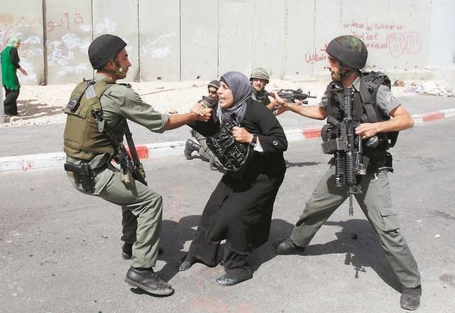 IOF Strom Shu'fat Camp, Detain Palestinian Man, Woman