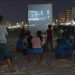 On a warm summer night, the sound of laughter and applause fills the air as a crowd of Palestinians watch a movie on a makeshift screen on the beach. They are enjoying a rare treat: a seaside cinema that offers them a brief escape from the hardships of life in the Gaza Strip.