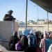 Palestinian women cross the Qalandiya checkpoint, outside of the West Bank city of Ramallah, on April 15, 2022. (Flash90)