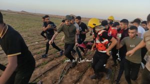 Palestinian medics and demonstrators rush to aid a critically wounded Palestinian, apparently shot by Israeli occupation forces in eastern Khan Yunus, September 19th.