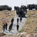 Israeli troops take position during clashes between Palestinians and Israeli troops after Israeli machinery demolish a school near Bethlehem in the Israeli-occupied West Bank May 7, 2023. REUTERS/Mussa Qawasma