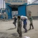 Gaza children are waiting to receive flour amidst Israel's closure of Aids