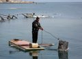 Gazan Fisherman Innovates Raft from Fridge Doors Amid Destruction of Gaza’s Fishing Sector